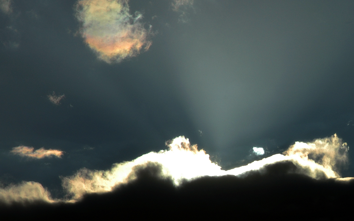 Sunrays And Iridescent Clouds